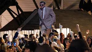 PHOTO: A cutout image of former Penn State football coach is raised in the