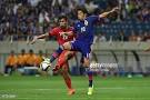 Singapore players celebrate after the match against Japan during.