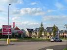 One of many Sales Offices and housing on Loves Farm Estate. - via Daymix