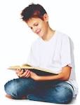 boy reading the book | Natural Awakenings Magazine Charlotte