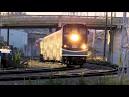 Metrolink train derails in crash with truck; emergency personnel.