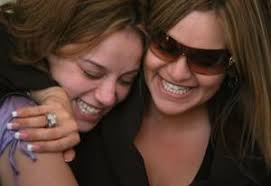 Singer Jenni Rivera, right, embraces her younger sister, Rosa Rivera, Wednesday after Jenni&#39;s former husband, Trinidad Marin, was found guilty on eight ... - 20070510_010220_15_300