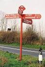 Anderson: Red Post. This signpost is often damaged and often repaired. - via Daymix