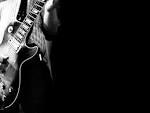 http://dark.pozadia.org/images/wallpapers/guitar-wallpaper-1024x768-951605.jpeg