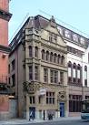 It has been absorbed into a piece of postmodern horridness. Grade II listed. - via Daymix