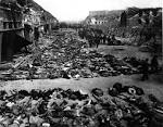 File:Rows of bodies of dead inmates fill the yard of Lager ...