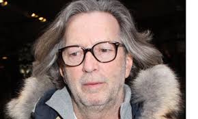 North Korea asked America to arrange an Eric Clapton concert in Pyongyang, saying that it could help to persuade Kim Jong-il to allow humanitarian aid into ... - Eric-Clapton-in-New-York--006