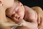 child on its mother's lap,