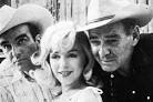 (Clark Gable a Marilyn Monroe