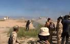Iraqi forces, militias sweep into Islamic State-held Tikrit.