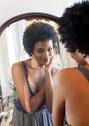 girl looking in mirror image