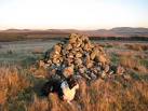 Cairn on Hare Law. The larger cairn, on the summit. Evidence around the - via Daymix