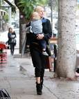 Make-up free Malin Akerman dotes on son Sebastian as she braves.