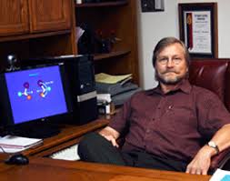 Professor of Chemistry David Shubert, Ph.D., with a page from his current e-textbook. Shubert recently signed a contract with Cengage Publishing to produce ... - Shubert-ComputerScreen-Sm