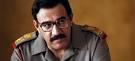 Igal Naor as Saddam Hussein in