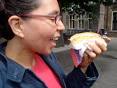 Nicole samples raw salted fish + raw onions on a bun in The Hague - 155