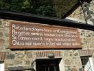 This board carrying a 'Latin' inscription can be seen on one of the houses - via Daymix