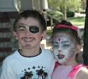 Barbara Taylor, face painter designing Jonathan High's pirate face