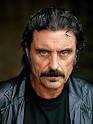 cursing brothel owner Ian McShane is “in talks” to be the villain in