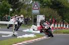 John McGuinness on his Honda - via Daymix