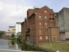 Flour Mills and Storage Silos. The River is the Nene, pronounced 'nen' - via Daymix