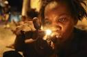 A drug user consumes crack in