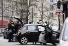 Charlie Hebdo attack: worldwide vigils as France seeks gunmen.