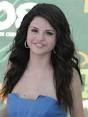 ... at Valentino's 50th Anniversary on March 27, 2012 (left); Selena Gomez ... - 72847_selena-gomez-is-bashful-in-blue