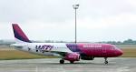 File:Wizz Air - HA-LPD - AIRBUS A320 with pushback tractor.