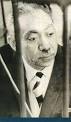 Sayyid Qutb behind bars in an