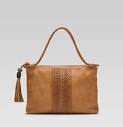 http://www.funkyfashiontrend.com/wp-content/uploads/2011/02/handmade-medium-shoulder-bag-with-woven-web-detail-and-tassels-with-metal-G-and-leather-monkey-fist-details.jpg