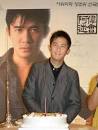 Tony Leung smiles to the