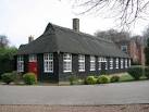 The thatched building houses the fiction library of the school. - via Daymix
