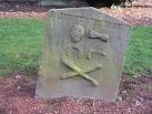 Memento Mori. The other side of John Smith's gravestone NT1166 : HERE LAYES - via Daymix