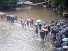 Rains stop Mumbai in tracks, commuters hit as trains cancelled.