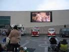 stage outside the transport museum whilst Miss Piggy (as Emily Cratchit) - via Daymix