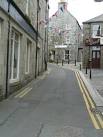 central Lerwick, big enough to take traffic unlike most of the closses. - via Daymix