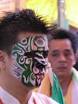 thm_PA100198.jpg. Facial art: When a medium's face is painted,