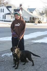 Here, Sierra Ordway, 12, of Wayland, is all bundled up as she walks Snickers, a Lab/Beagle mix. - 10461589-large