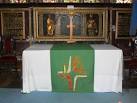 the altar cloth and the religious texts on the panels behind the altar. - via Daymix