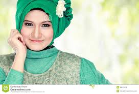 Young Beautiful Muslim Woman With Green Costume Wearing Hijab ...