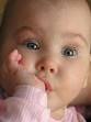 Cute thumb-sucking baby