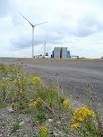 Fossil fuel and wind power. Two of the three wind turbines at Avonmouth - via Daymix