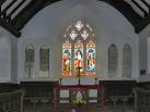 On either side of the east window are painted tablets with the Lord's Prayer - via Daymix