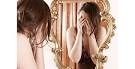 girl looking in mirror image