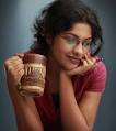 ABOUT ARCHANA KAVI: