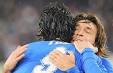 Andrea Pirlo gets a Toni hug: his shot just brought Italy to a 2-