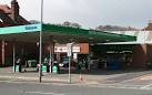 The photograph shows a fuel filling station and car hire centre at the - via Daymix
