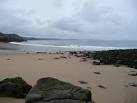 As waves crash onto the sand the headlands and bays eastwards become hazier - via Daymix