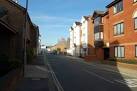 Modern blocks of flats replace more varied uses on the right hand side of - via Daymix